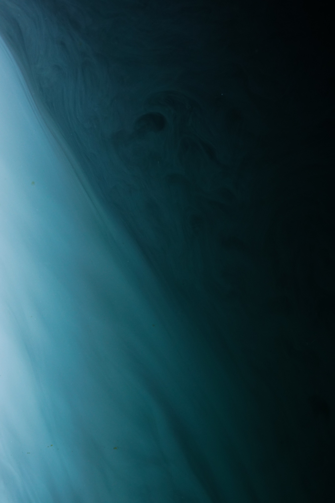 cloud chamber — illuminated fog inside a glass volume